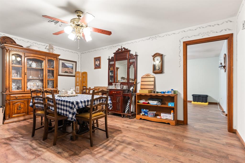 802 North Brazos Street Whitney, TX 76692 - Photo 7 of 33 a view of a dining room with furniture and chandelier