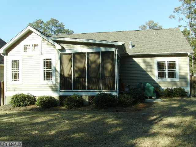 Exterior Back. Fenced in back yard & screened in porch