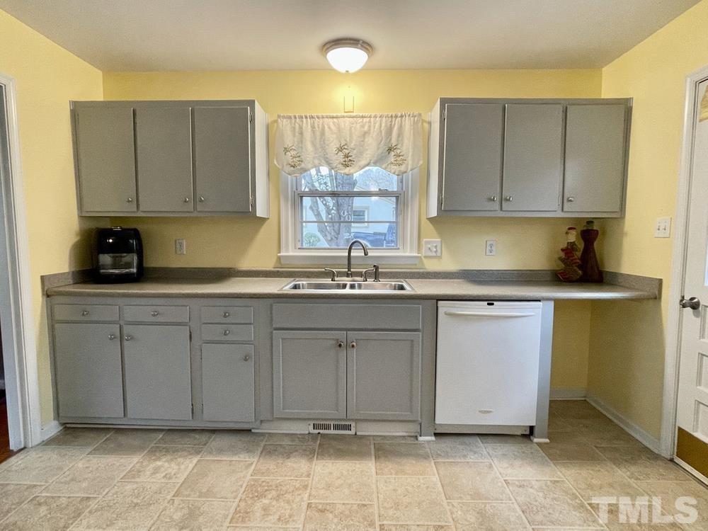 3625 Cranston Road Garner, NC 27529 - Photo 6 of 17 a kitchen with cabinets appliances and a counter top space