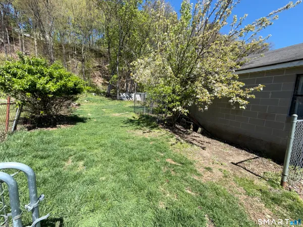 a backyard of a house with lots of green space