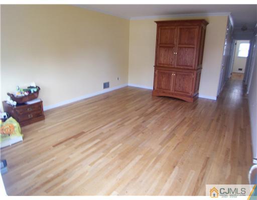 72 Middle Hill Road Colonia, NJ 07067 - Photo 2 of 17 a view of empty room with wooden floor