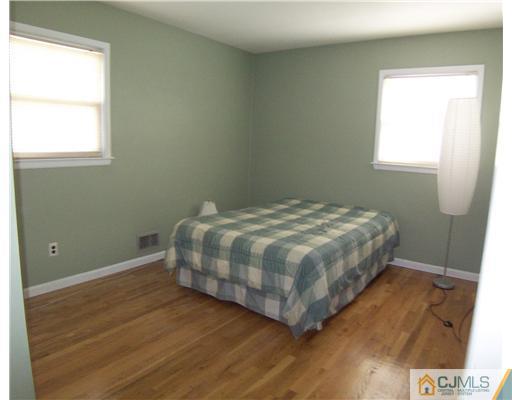 72 Middle Hill Road Colonia, NJ 07067 - Photo 12 of 17 a bedroom with a bed and a window