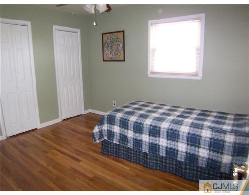 72 Middle Hill Road Colonia, NJ 07067 - Photo 13 of 17 a bedroom with a bed and a window