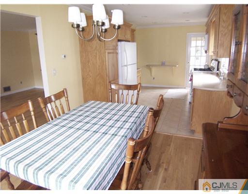 72 Middle Hill Road Colonia, NJ 07067 - Photo 3 of 17 a bedroom with a bed and wooden floor