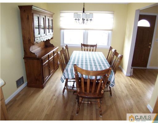 72 Middle Hill Road Colonia, NJ 07067 - Photo 4 of 17 a view of a dining room with furniture window and wooden floor
