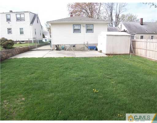 72 Middle Hill Road Colonia, NJ 07067 - Photo 9 of 17 a backyard of a house with table and chairs