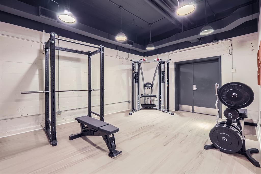 710 Colorado Street, Unit 4J Austin, TX 78701 - Photo 30 of 37 Workout room featuring wood finished floors