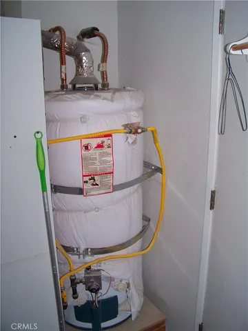 a room with a sink and mirror