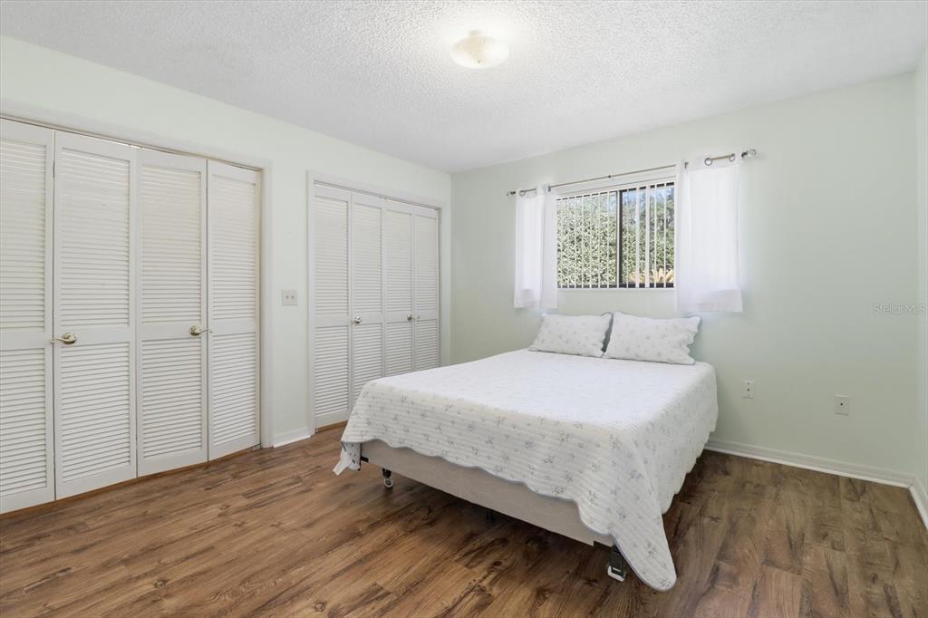 3966 North Spanish Moss Point Beverly Hills, FL 34465 - Photo 24 of 39 a bed sitting in a spacious bedroom next to a window