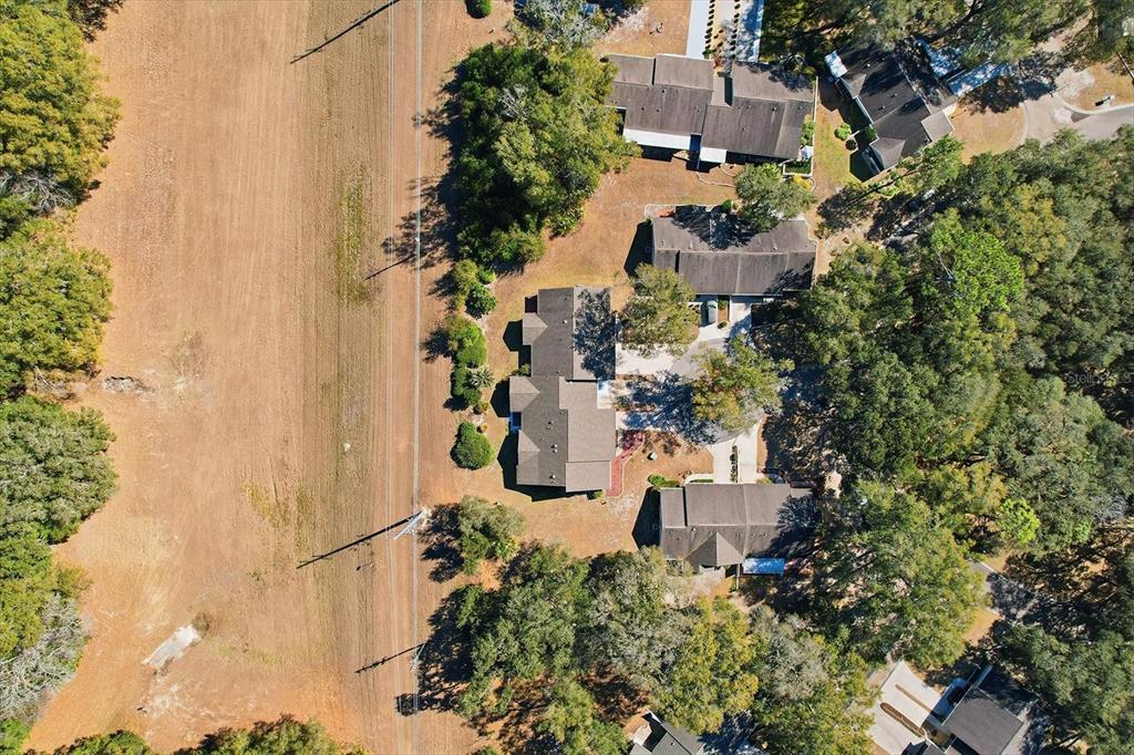 3966 North Spanish Moss Point Beverly Hills, FL 34465 - Photo 34 of 39 an aerial view of a house with a yard and garden