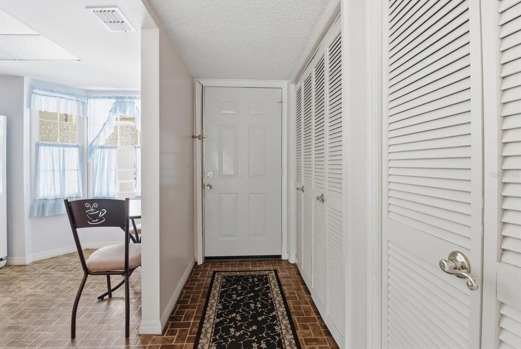3966 North Spanish Moss Point Beverly Hills, FL 34465 - Photo 9 of 39 a view of a hallway and an dining rom with furniture