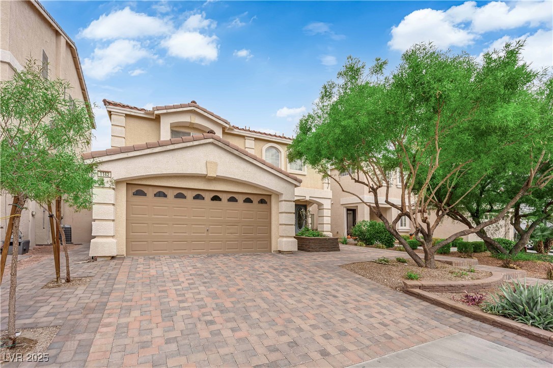 1142 Sax Fifth Avenue Henderson, NV 89052 - Photo 2 of 44 Another angle of the spacious paver driveway and inviting entryway.