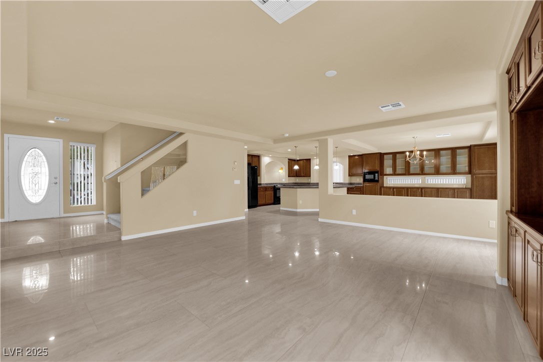 1142 Sax Fifth Avenue Henderson, NV 89052 - Photo 6 of 44 Grand entry with open sightlines, large tile flooring, and abundant natural light.