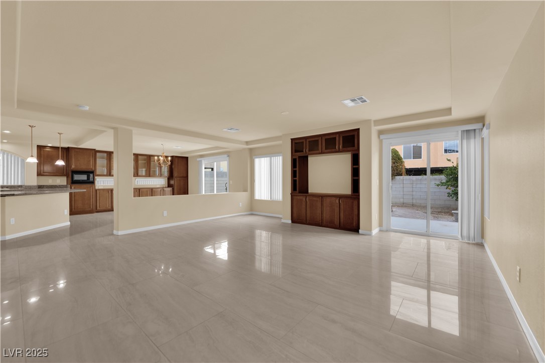 1142 Sax Fifth Avenue Henderson, NV 89052 - Photo 7 of 44 Expansive open-concept living room perfect for entertaining with seamless flow to the kitchen.
