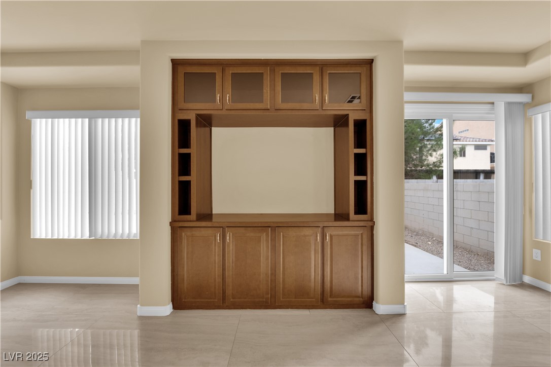 1142 Sax Fifth Avenue Henderson, NV 89052 - Photo 9 of 44 Wide, open layout with modern tile floors and neutral tones ready for any décor style.