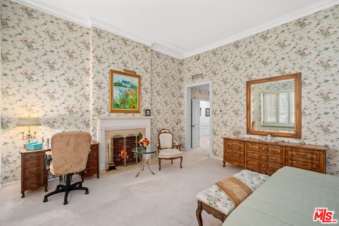 10114 Empyrean Way, Unit 302 Los Angeles, CA 90067 - Photo 20 of 37 a living room with furniture and a fireplace