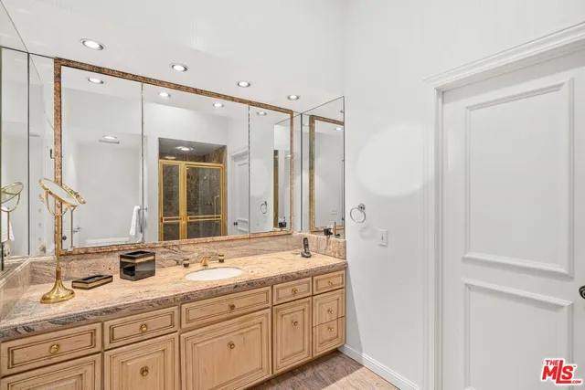 a bathroom with double sink and a mirror