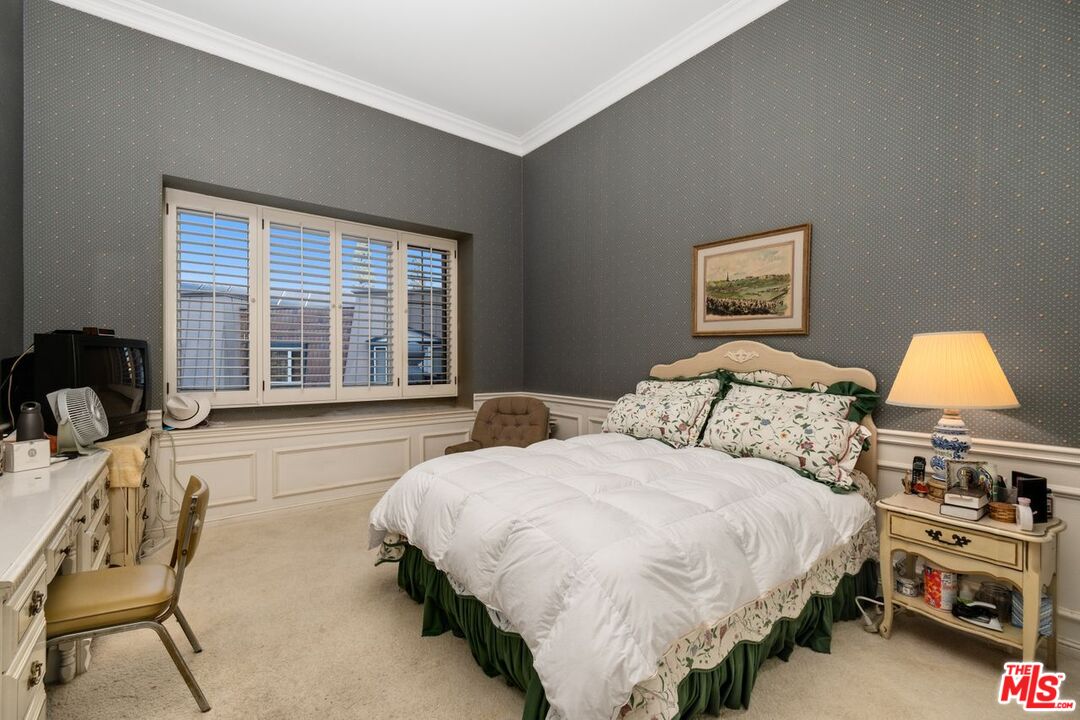 10114 Empyrean Way, Unit 302 Los Angeles, CA 90067 - Photo 30 of 37 a bedroom with a bed and a window