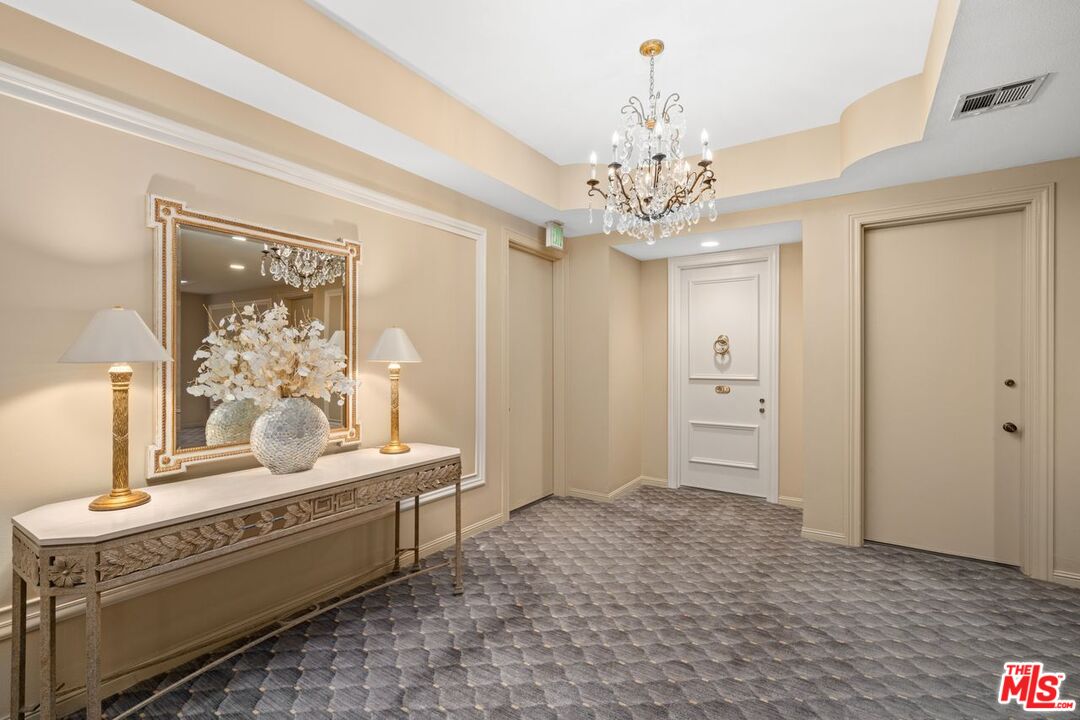 10114 Empyrean Way, Unit 302 Los Angeles, CA 90067 - Photo 32 of 37 a spacious bathroom with a double vanity sink and a mirror