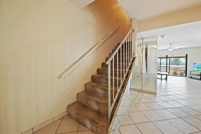 a spacious bedroom with a bed and a table
