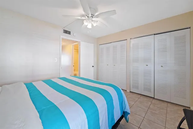 a bathroom with a sink toilet vanity and shower