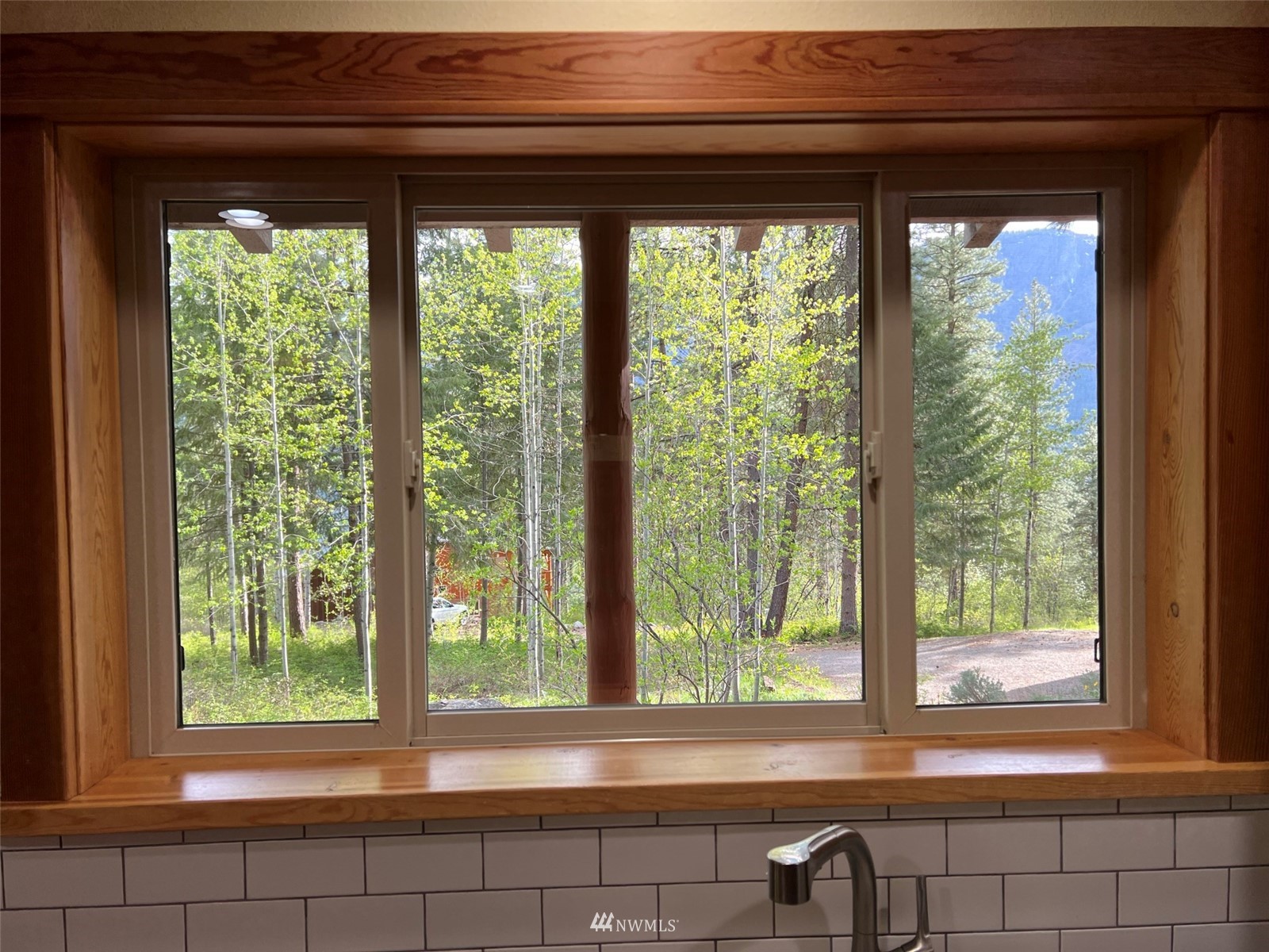 22 Trillium Road Winthrop, WA 98862 - Photo 12 of 40 a view of a room that has a bed and a window