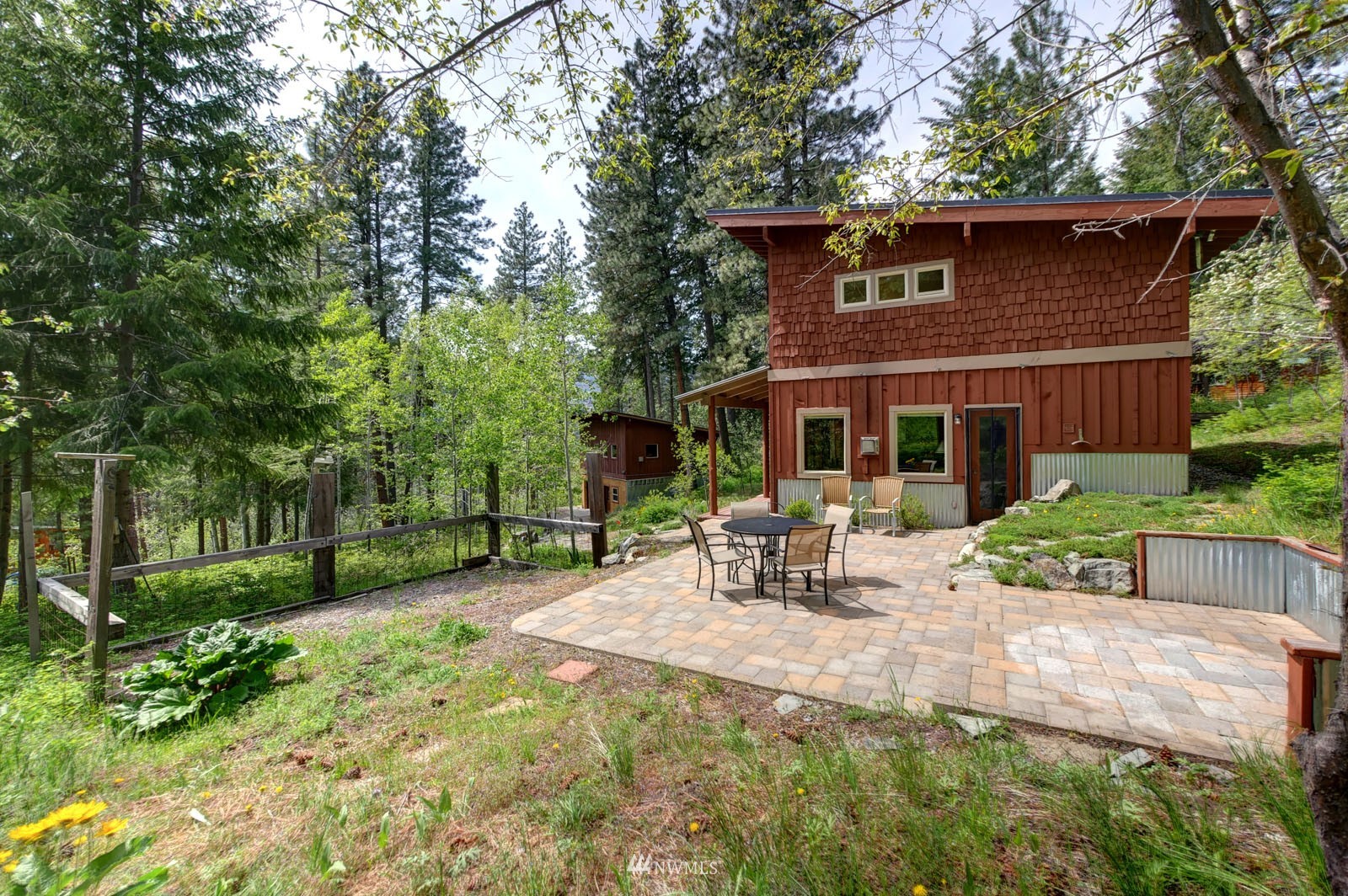 22 Trillium Road Winthrop, WA 98862 - Photo 29 of 40 a view of a house with backyard sitting area and garden