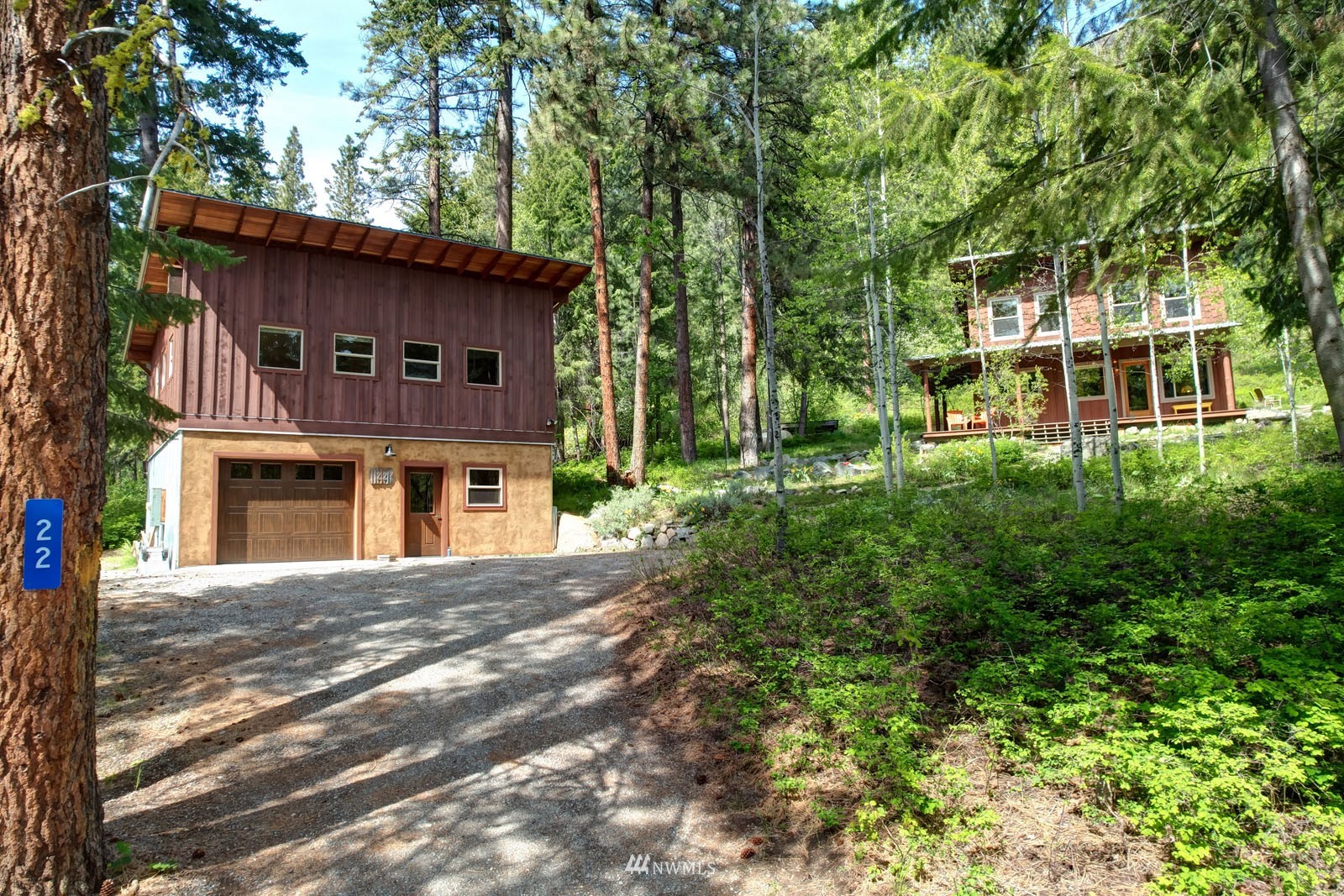 22 Trillium Road Winthrop, WA 98862 - Photo 8 of 40 a front view of a house with a garden