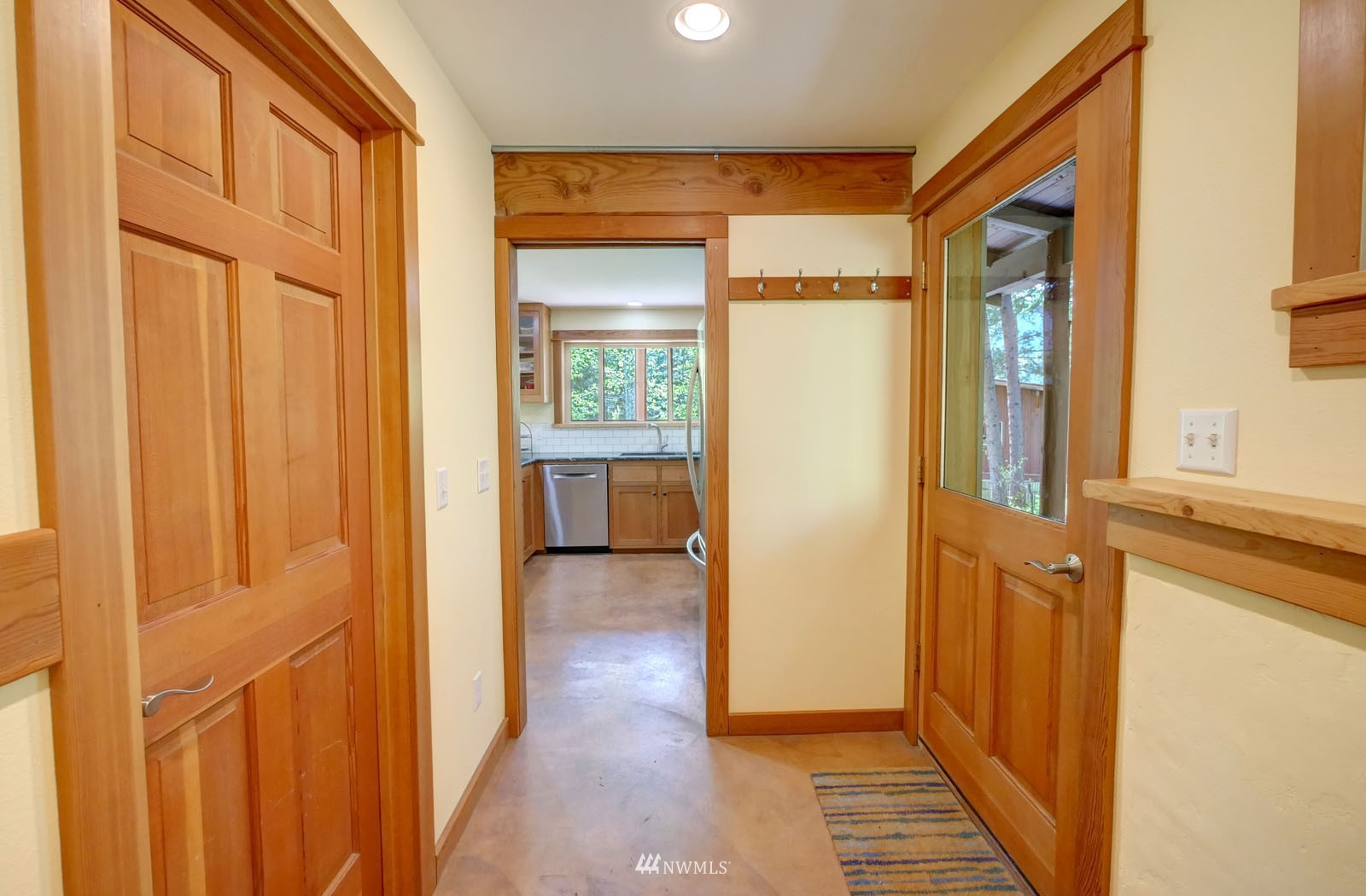22 Trillium Road Winthrop, WA 98862 - Photo 10 of 40 a view of a hallway with wooden floor and a bathroom