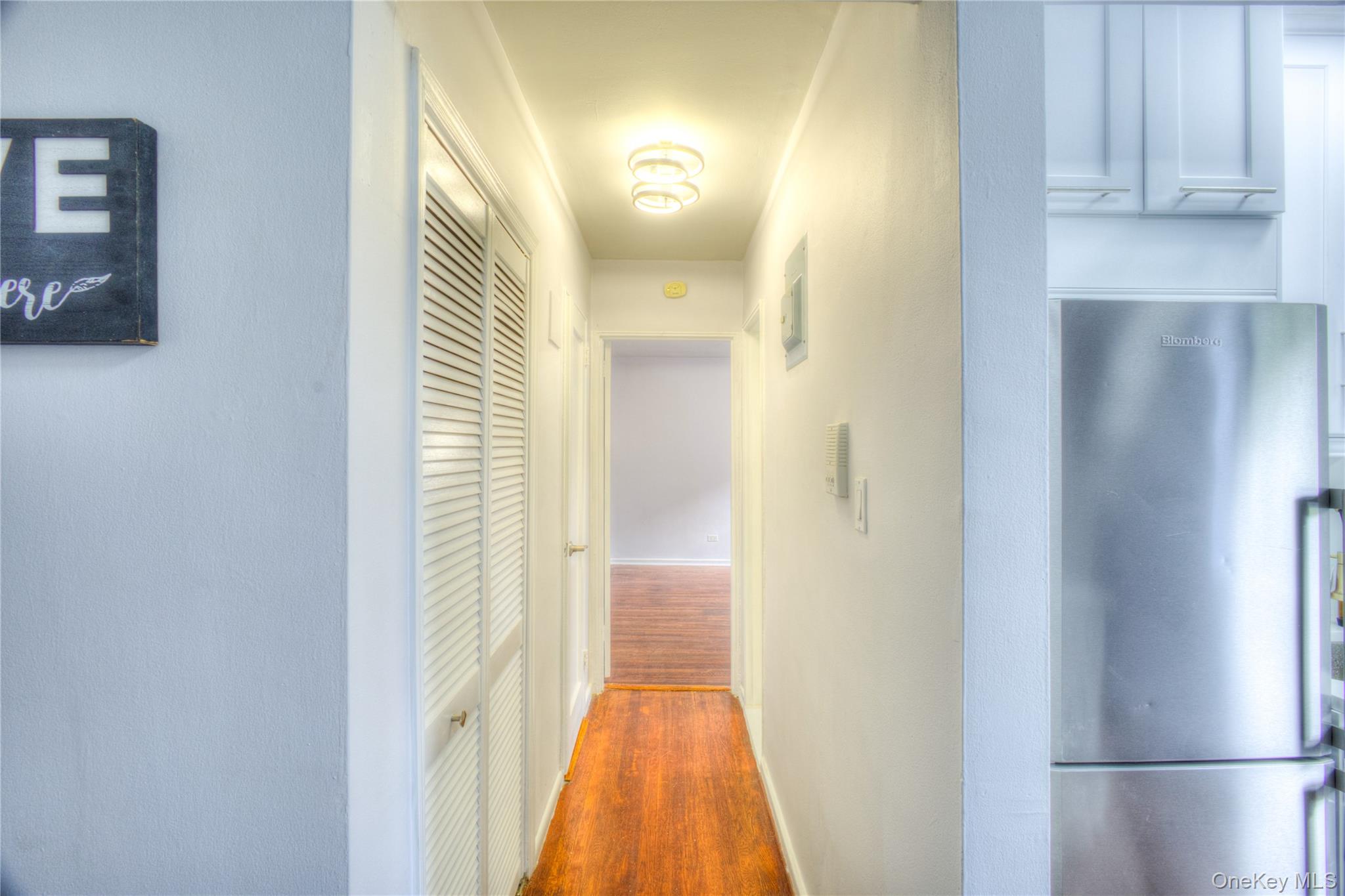 14401 78th Road, Unit 2B Queens, NY 11367 - Photo 14 of 29 Hall with dark wood finished floors and baseboards