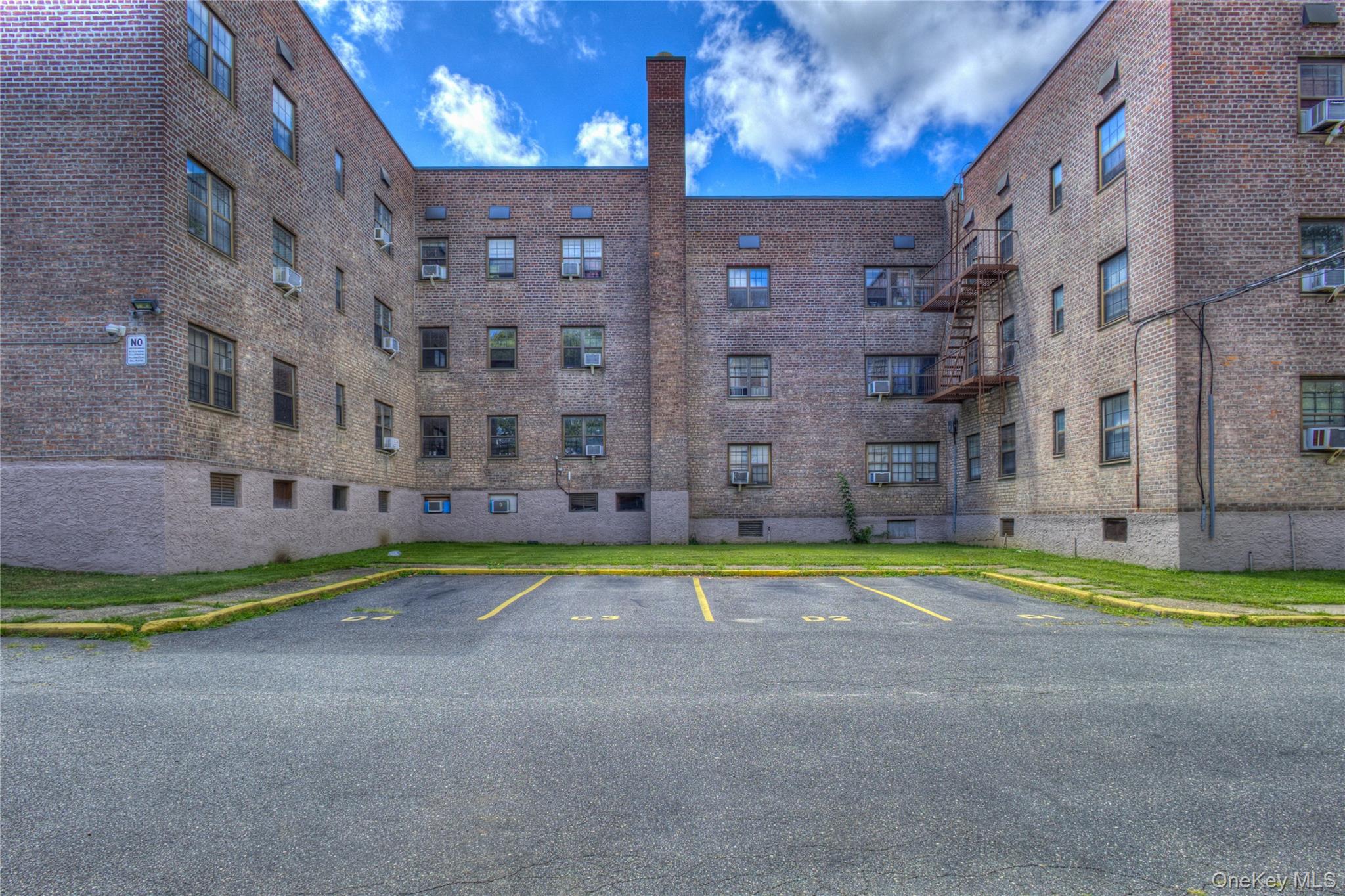 14401 78th Road, Unit 2B Queens, NY 11367 - Photo 24 of 29 View of apartment building / complex featuring uncovered parking