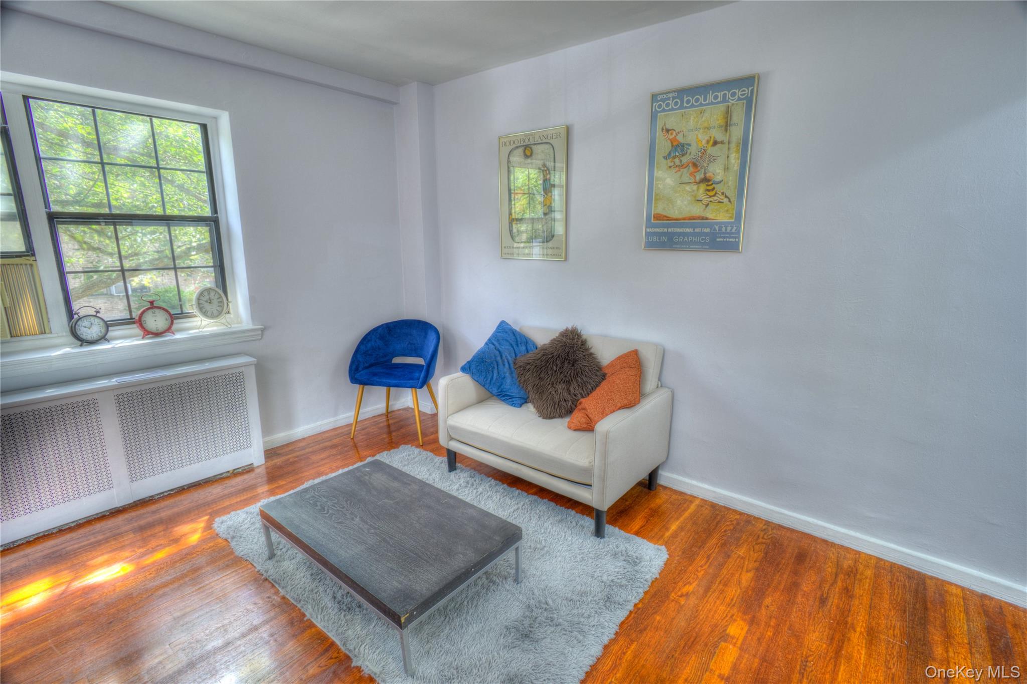 14401 78th Road, Unit 2B Queens, NY 11367 - Photo 4 of 29 Sitting room featuring radiator and wood finished floors