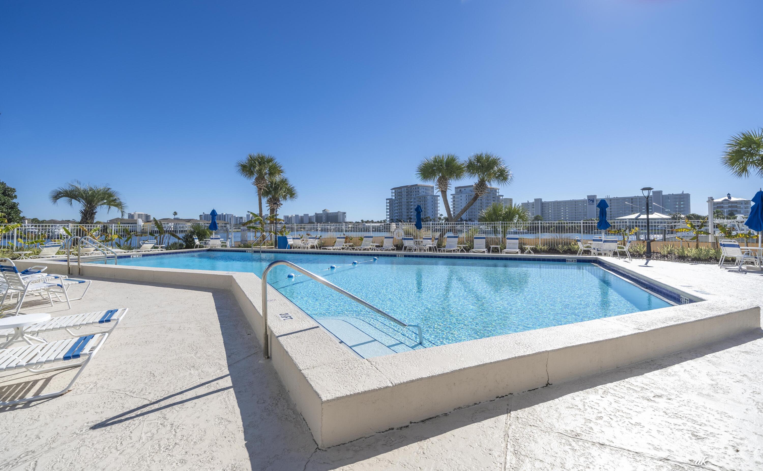 30 Moreno Point Road, Unit 404A Destin, FL 32541 - Photo 48 of 52 a view of a swimming pool with a terrace