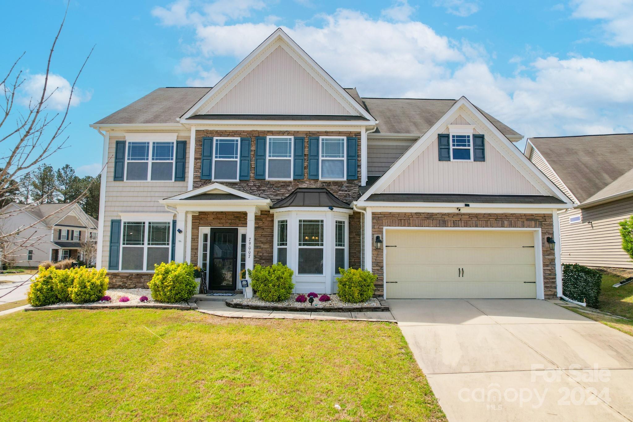 79007 Ridgehaven Road Lancaster, SC 29720 - Photo 2 of 48 a front view of a house with garden
