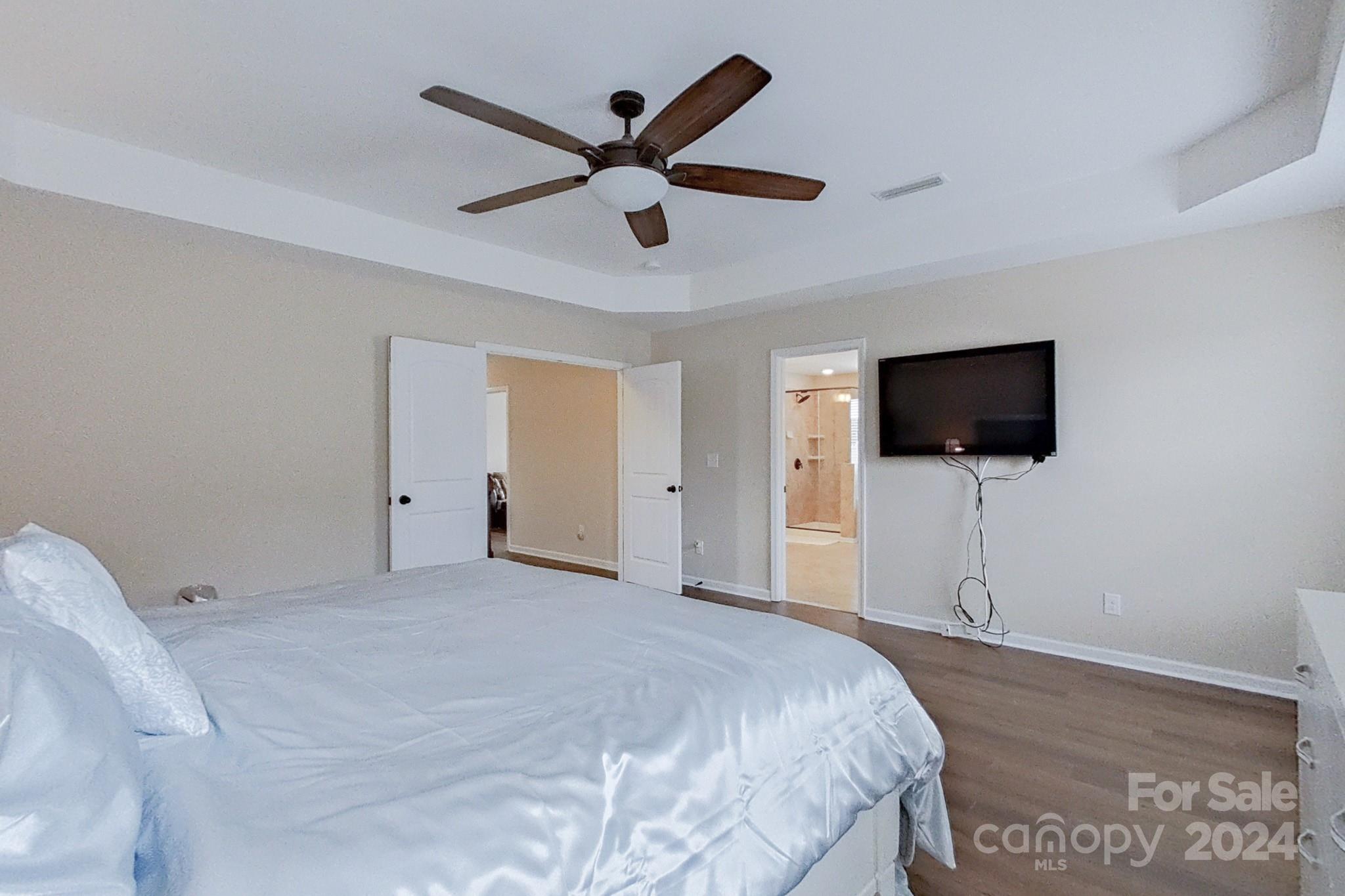 79007 Ridgehaven Road Lancaster, SC 29720 - Photo 25 of 48 a bedroom with a bed and a flat screen tv
