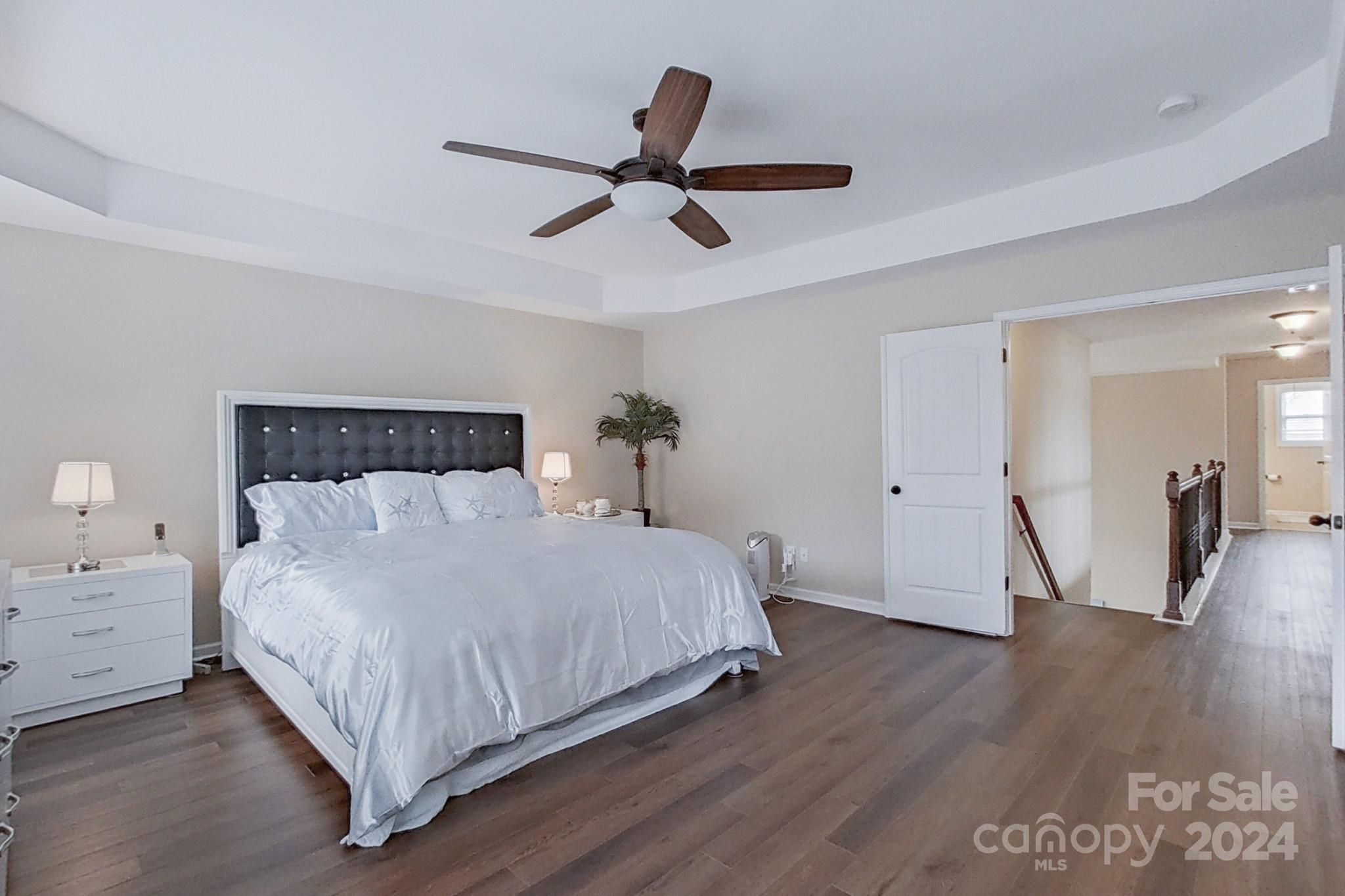 79007 Ridgehaven Road Lancaster, SC 29720 - Photo 26 of 48 a bedroom with a bed and wooden floor