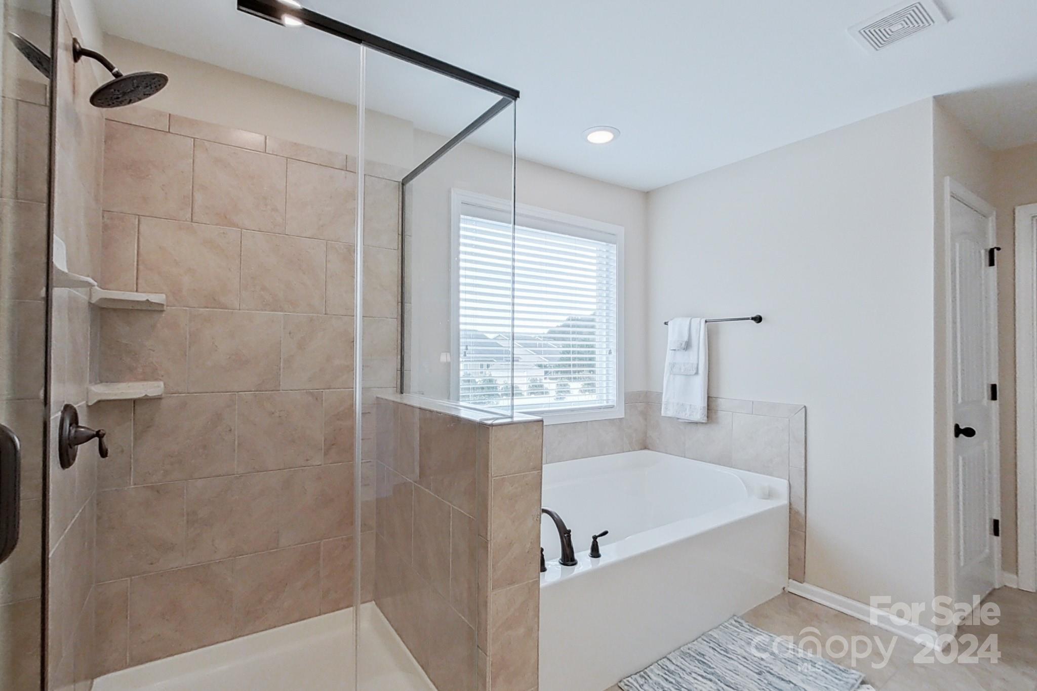 79007 Ridgehaven Road Lancaster, SC 29720 - Photo 28 of 48 a bathroom with a tub shower and a sink