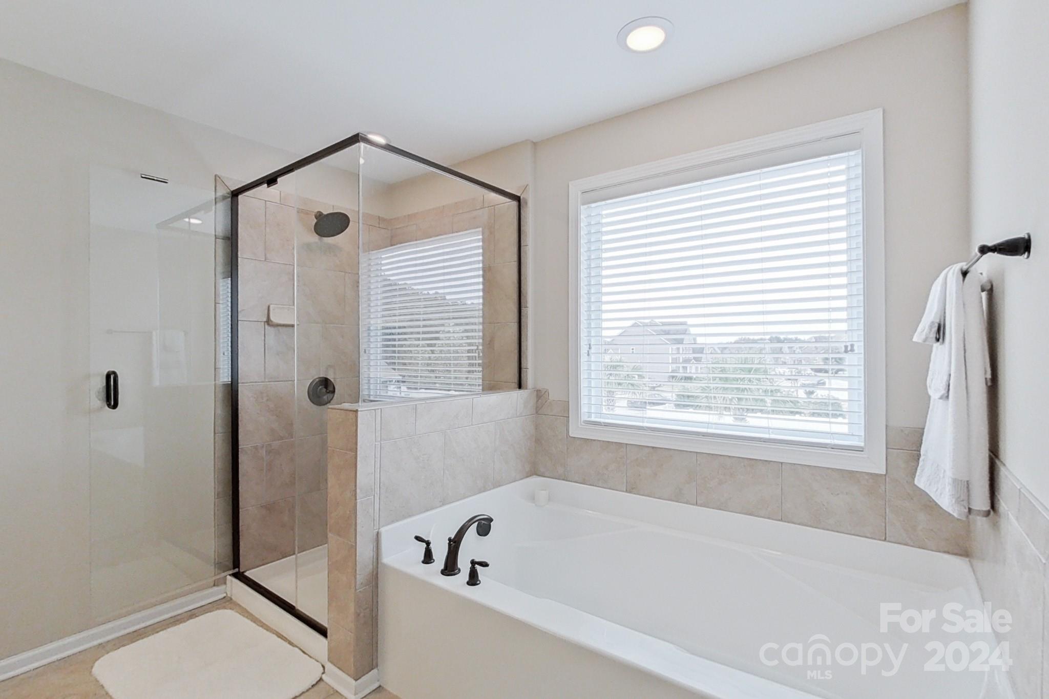 79007 Ridgehaven Road Lancaster, SC 29720 - Photo 29 of 48 a bathroom with a bathtub and shower
