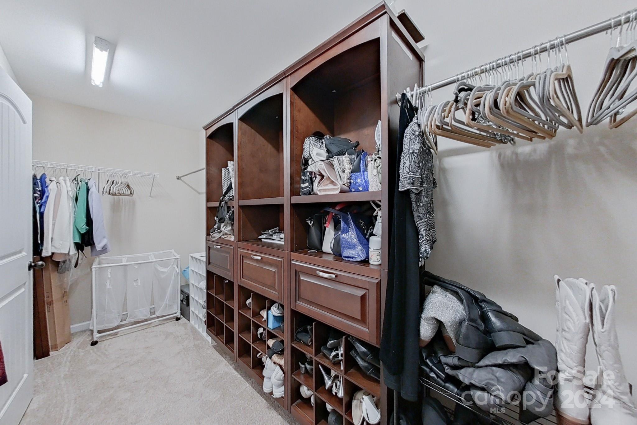 79007 Ridgehaven Road Lancaster, SC 29720 - Photo 30 of 48 a view of walk in closet with clothes and shoes