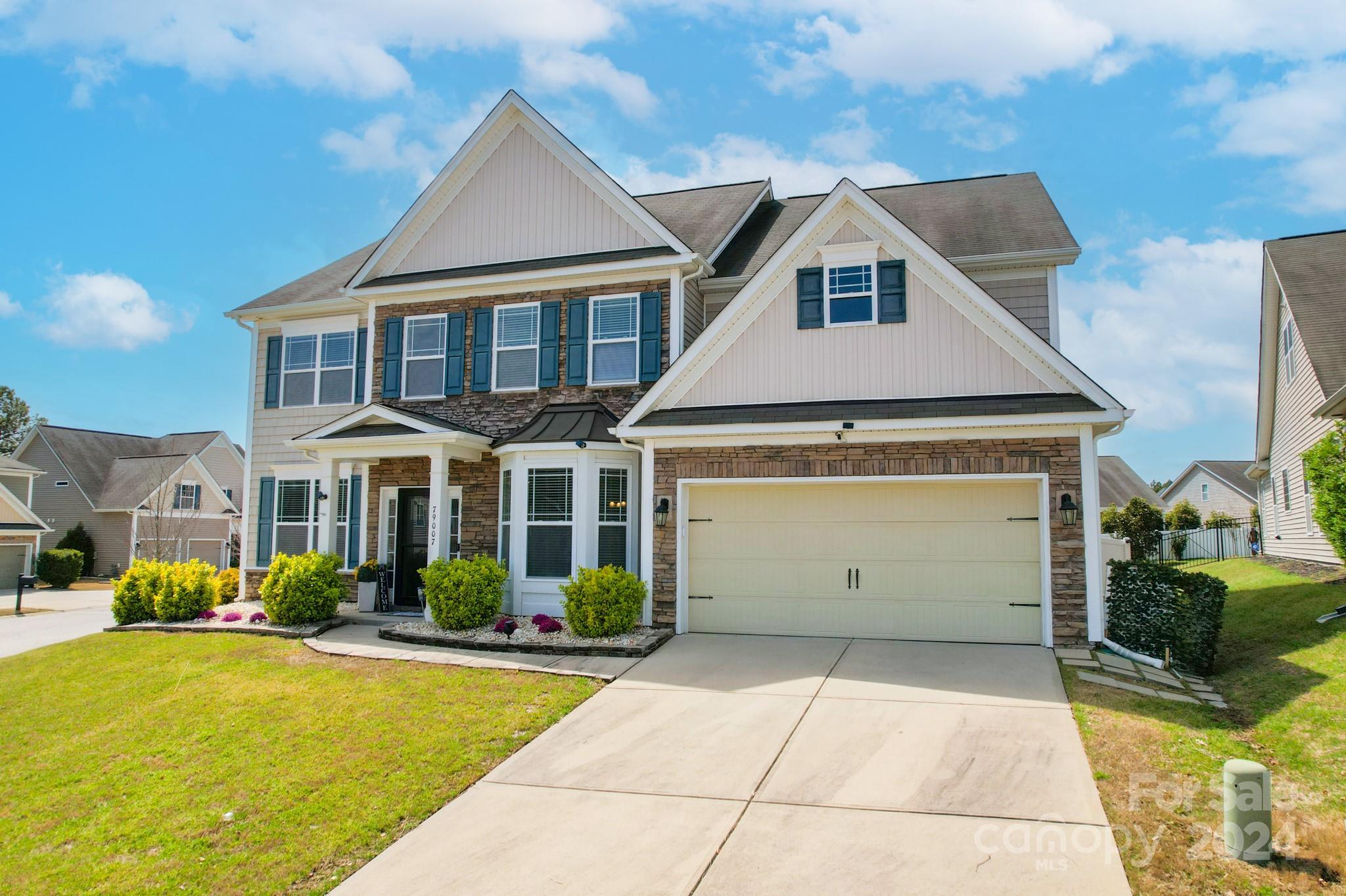 79007 Ridgehaven Road Lancaster, SC 29720 - Photo 3 of 48 a front view of a house with garden