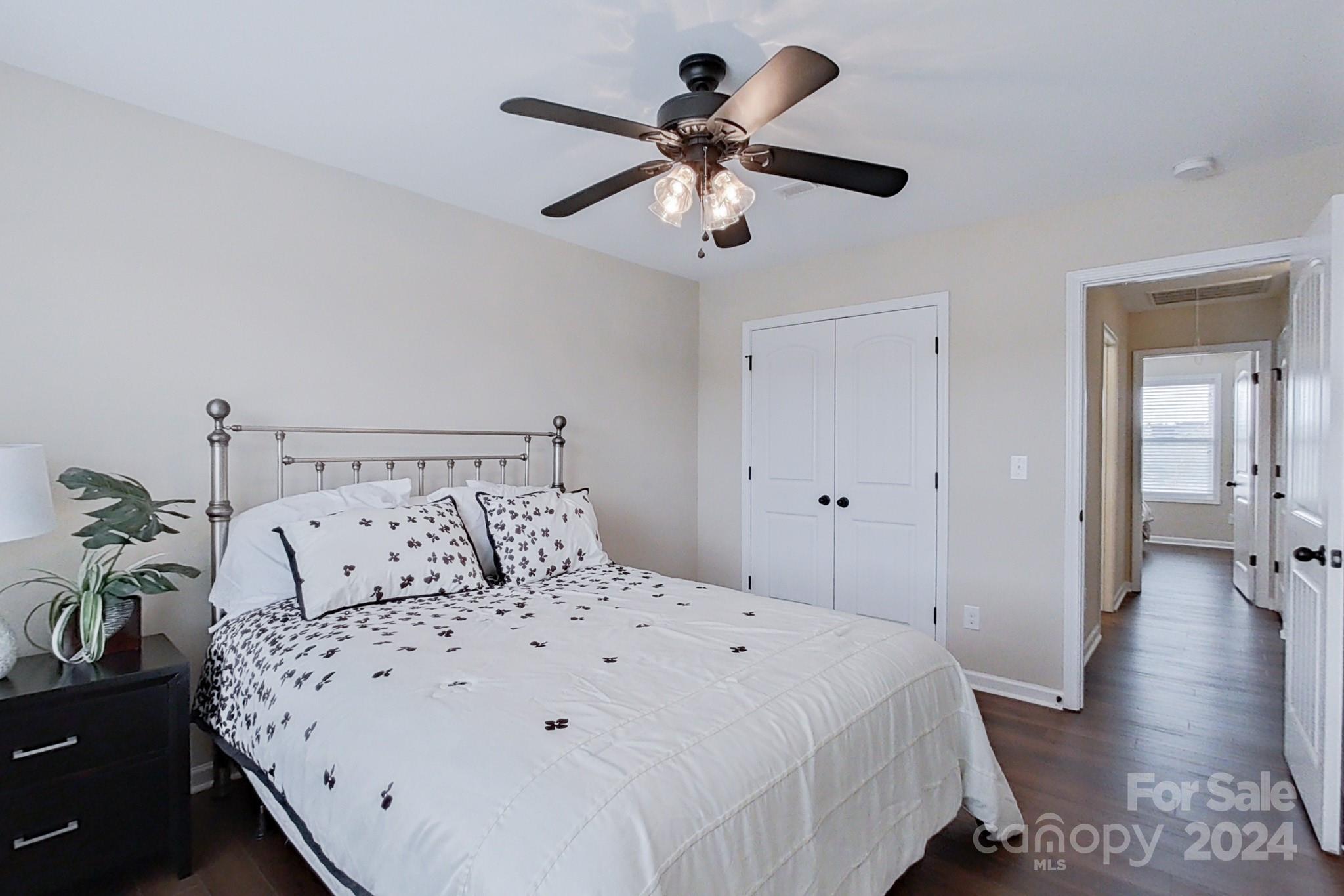 79007 Ridgehaven Road Lancaster, SC 29720 - Photo 34 of 48 a large bed sitting in a bedroom and a chandelier