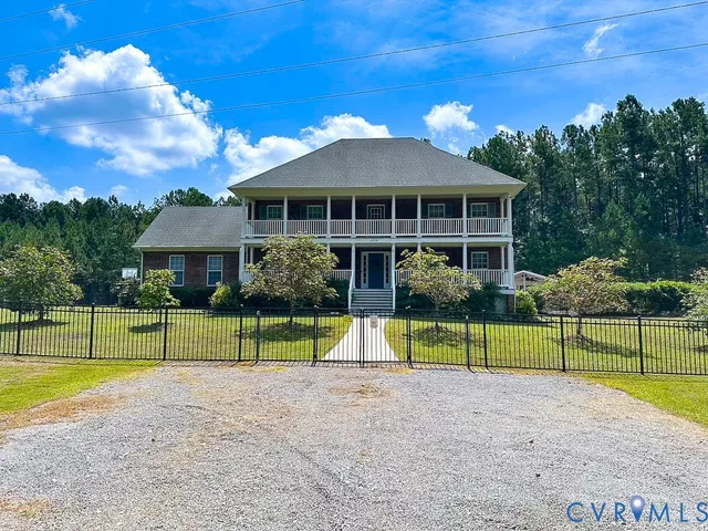 a view of house with backyard and entertaining space