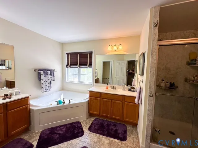 a view of a house with backyard porch and sitting area