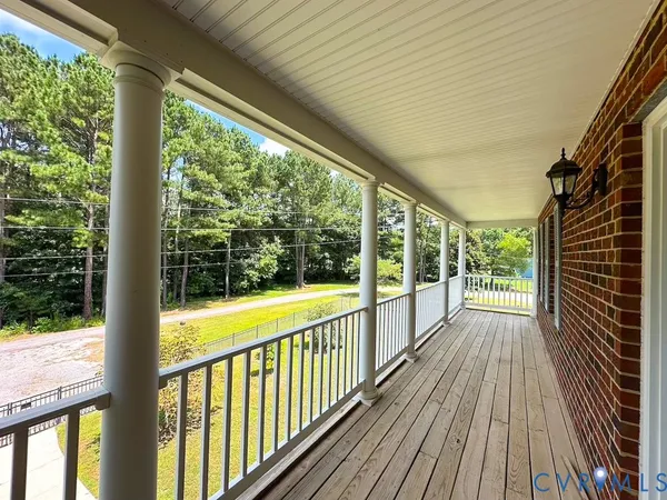 a view of a balcony with wooden floor