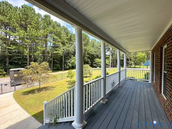 a view of a balcony with wooden floor