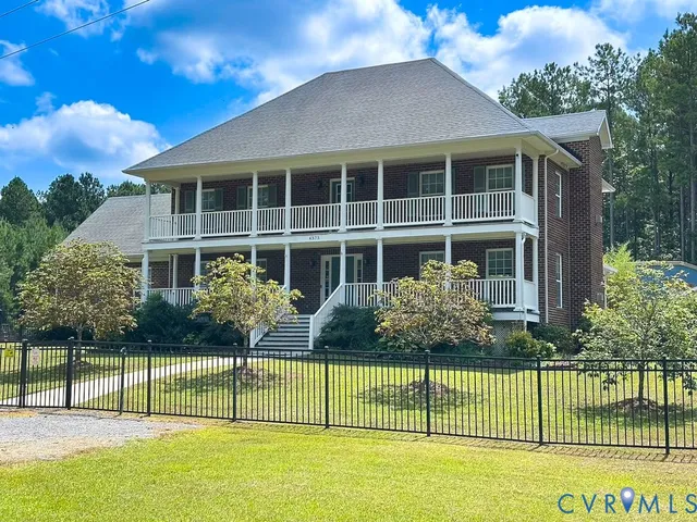 an aerial view of a house with outdoor space
