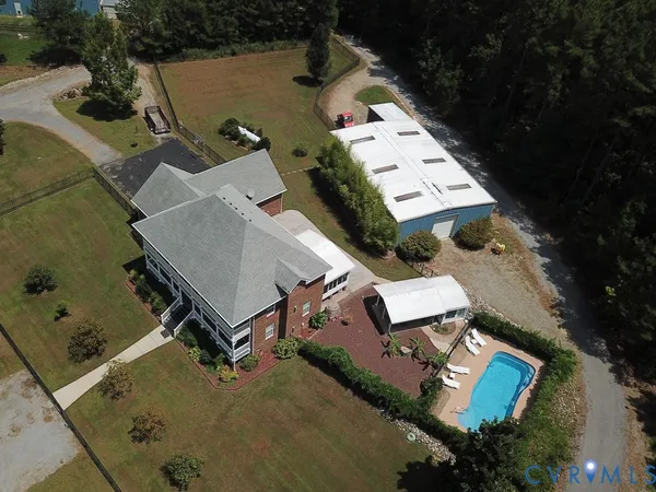 an aerial view of a house with outdoor space