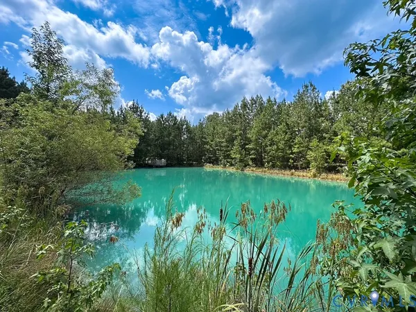 a view of a lake with a yard