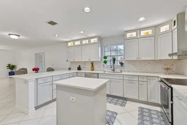 a kitchen with a refrigerator and a sink