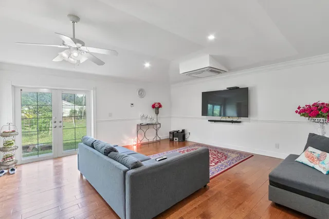 a living room with furniture and a rug